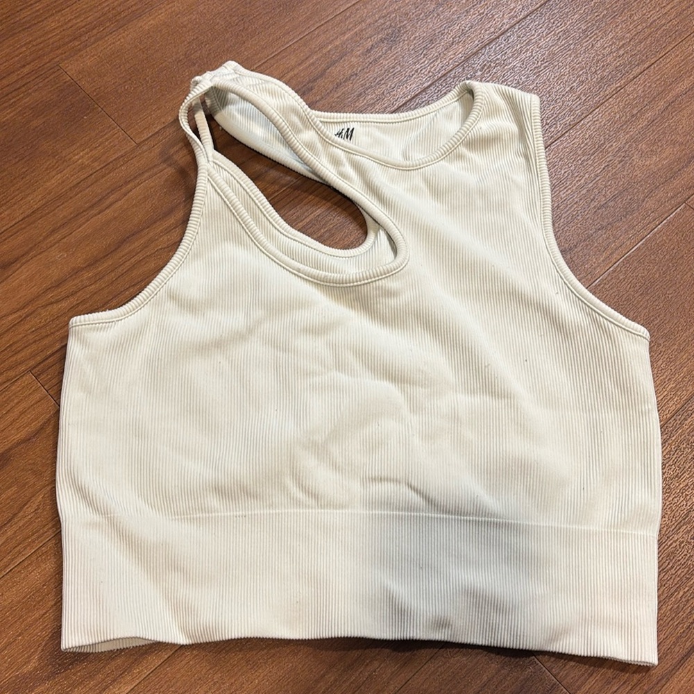 White asymmetrical cut crop top